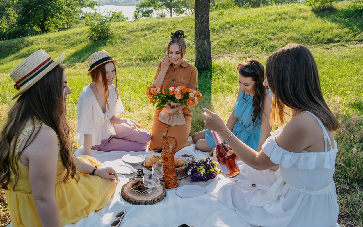 Friends sharing a picnic in a sunny park