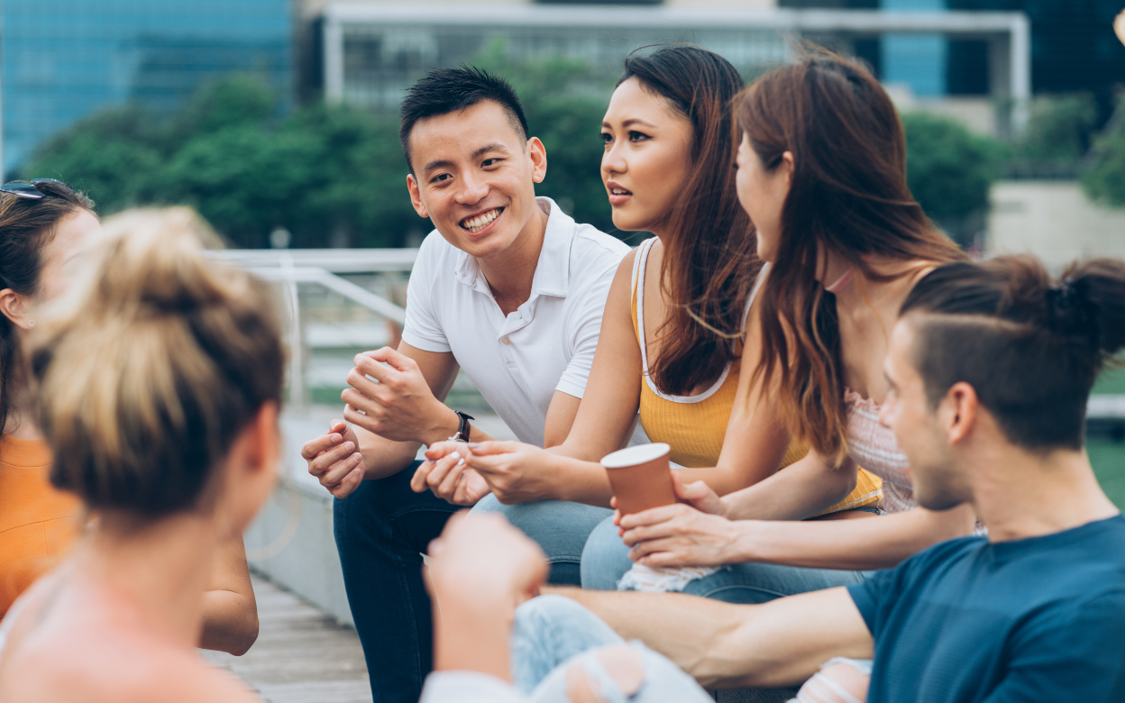A group of new friends chatting outdoors